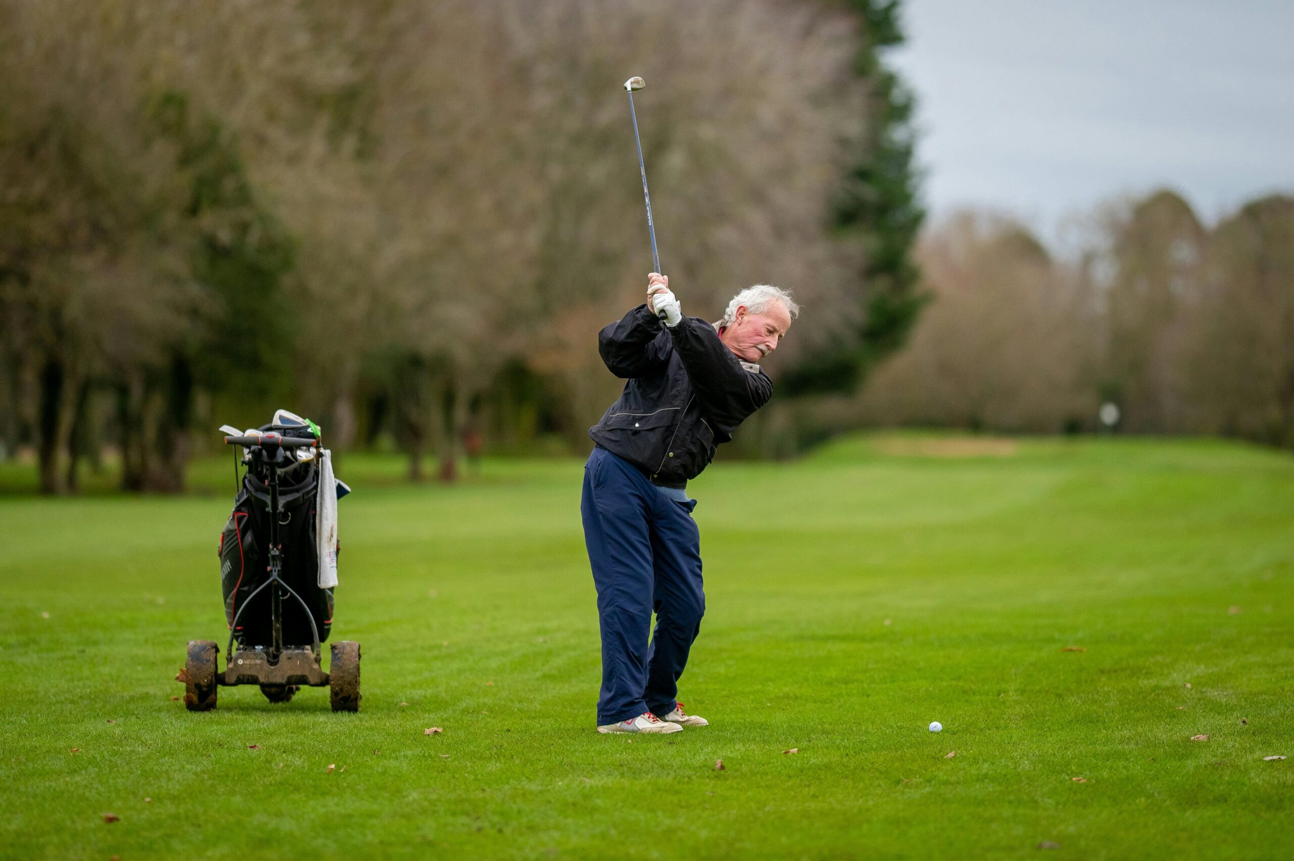 how to increase club head speed for seniors -- Senior hitting ball in the golf course